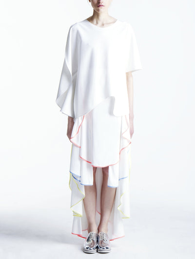 model in white maxi high low skirt