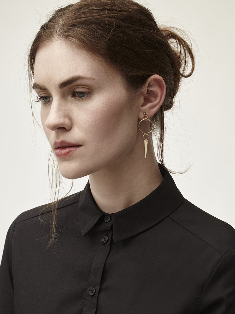 Model in Black with hair up spike stud earrings 