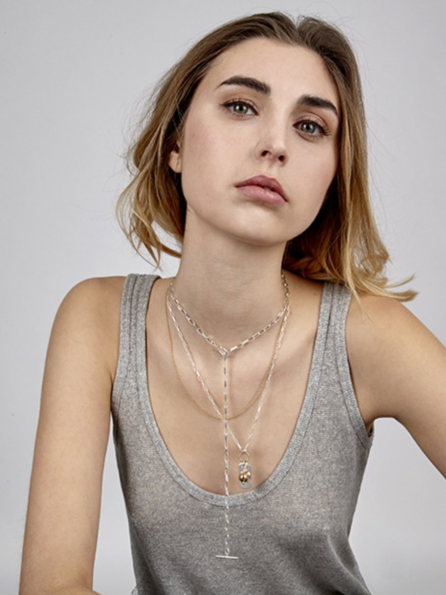 Model wearing two necklaces - Gabe and Emile - silver with chains