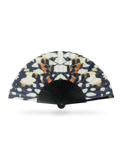 Khu Khu Black Nymph Hand Fan with black sticks and a symmetrical butterfly print in black, off white and hints of blue and burnt orange.