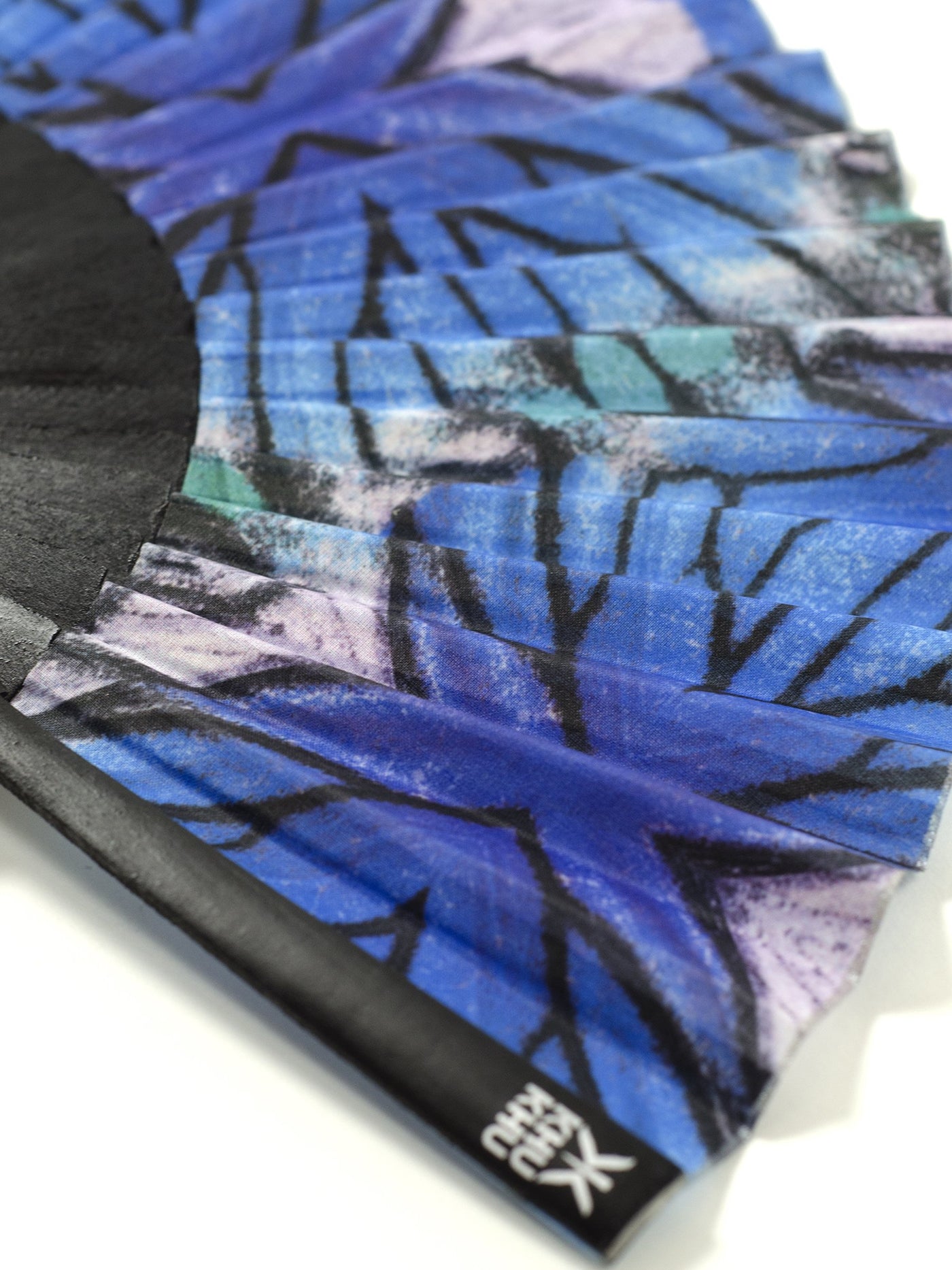 Close up of Blue Lyca butterfly print hand-fan from Khu Khu. Symmetrical geometric close up of real butterfly wing for print. Black sticks and silver detailing. 